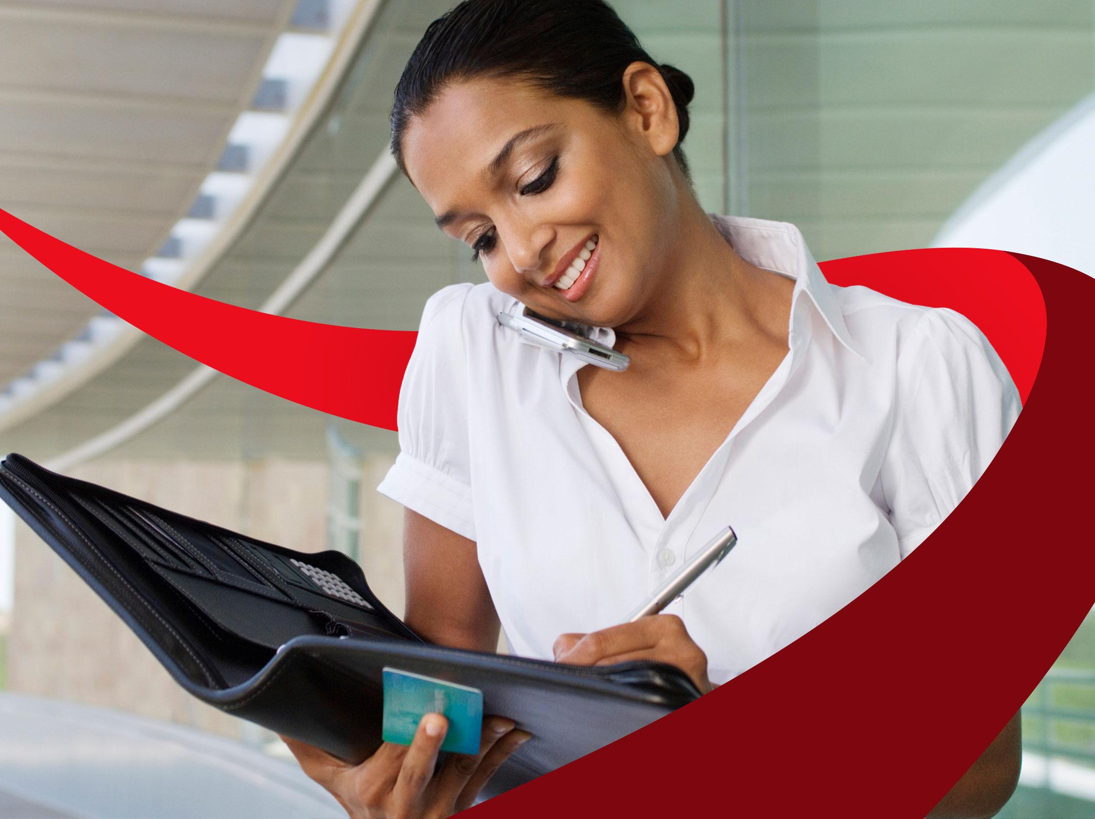 Administrative assistant writing in a notebook