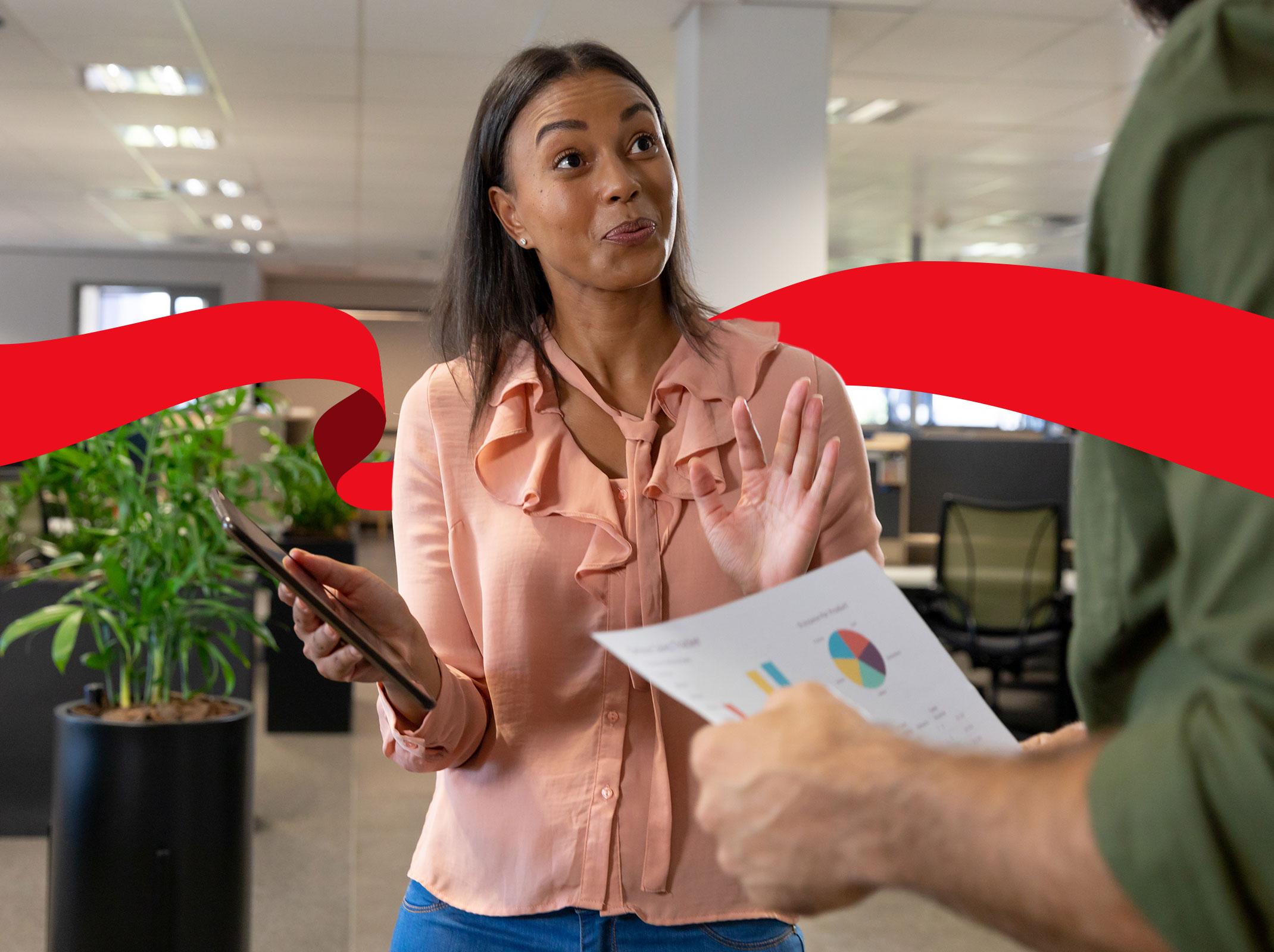 Co-workers engaged in distracting conversation at the office