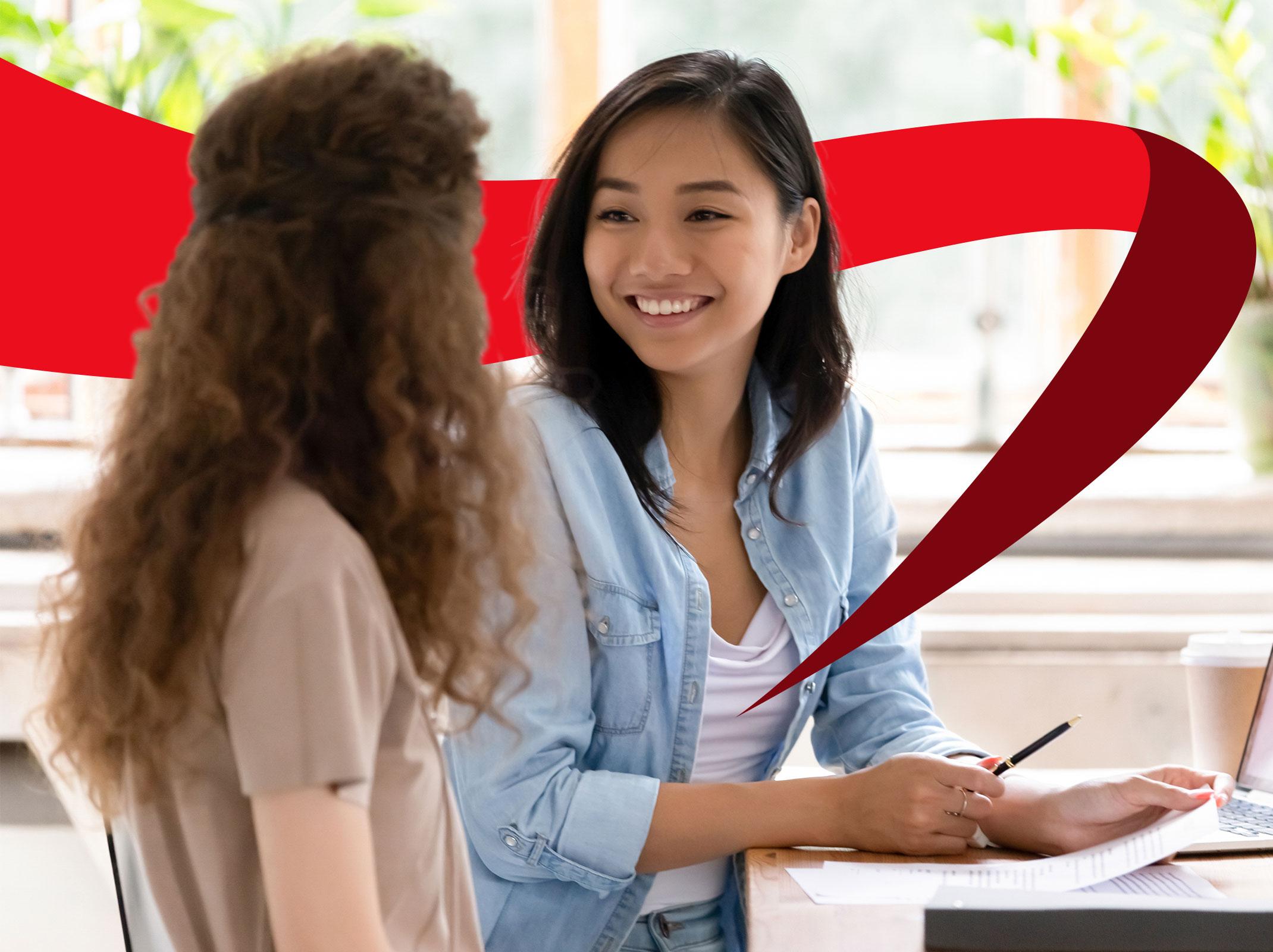 Two business professionals communicating effectively in an office setting