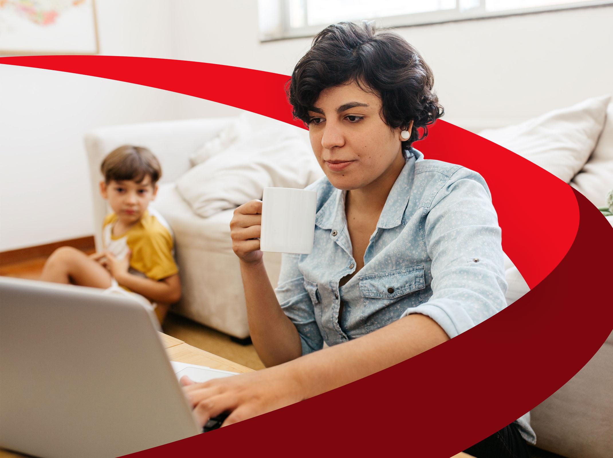 Woman working from home with a child in the background